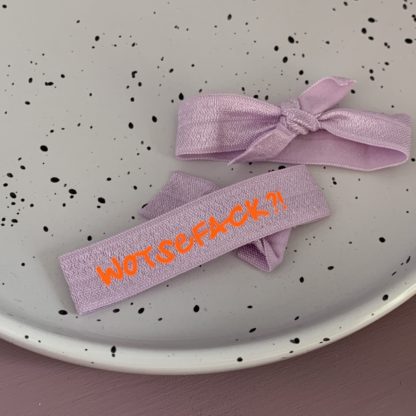 Wotsefack?! Armband lavendel pastell/ neonorange - Rückseite